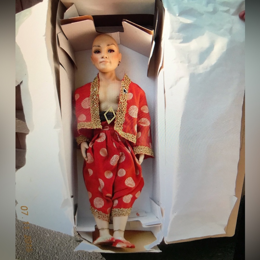 The King of Siam doll in box with Certificate of Authenticity.